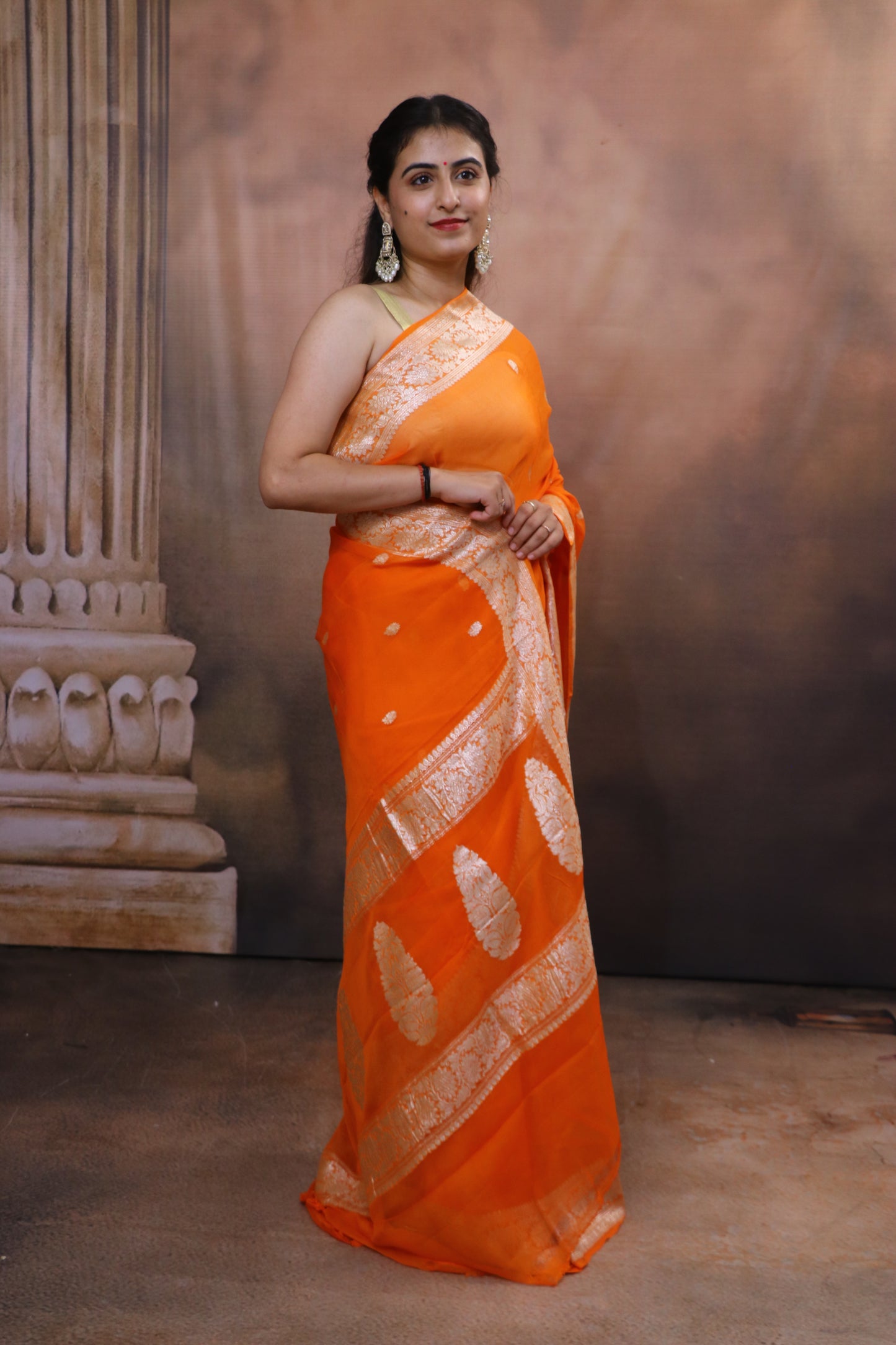 Handcrafted Khaddi Chiffon Saree With Kadua Buttis and Pure Silver Zari- Orange