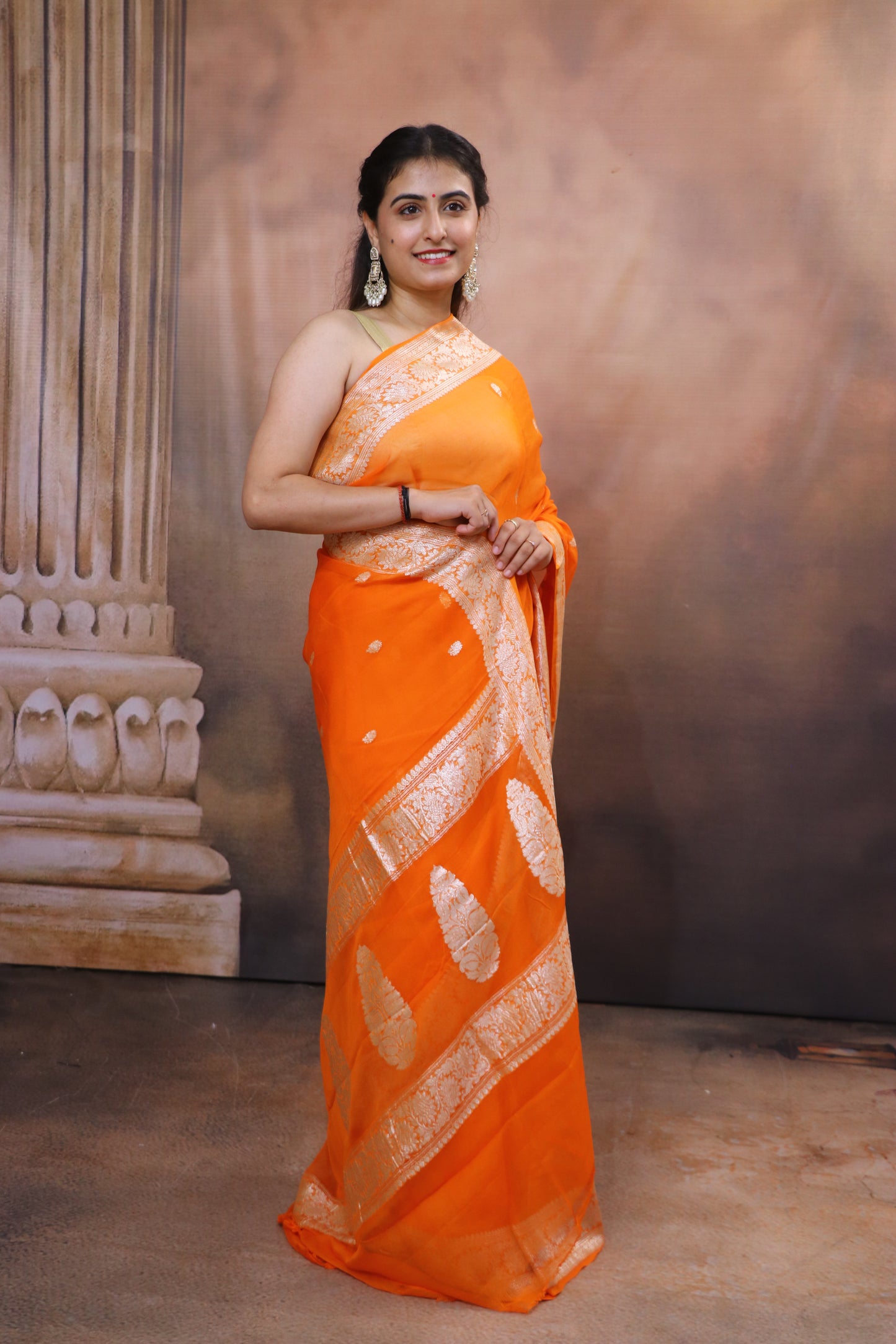 Handcrafted Khaddi Chiffon Saree With Kadua Buttis and Pure Silver Zari- Orange